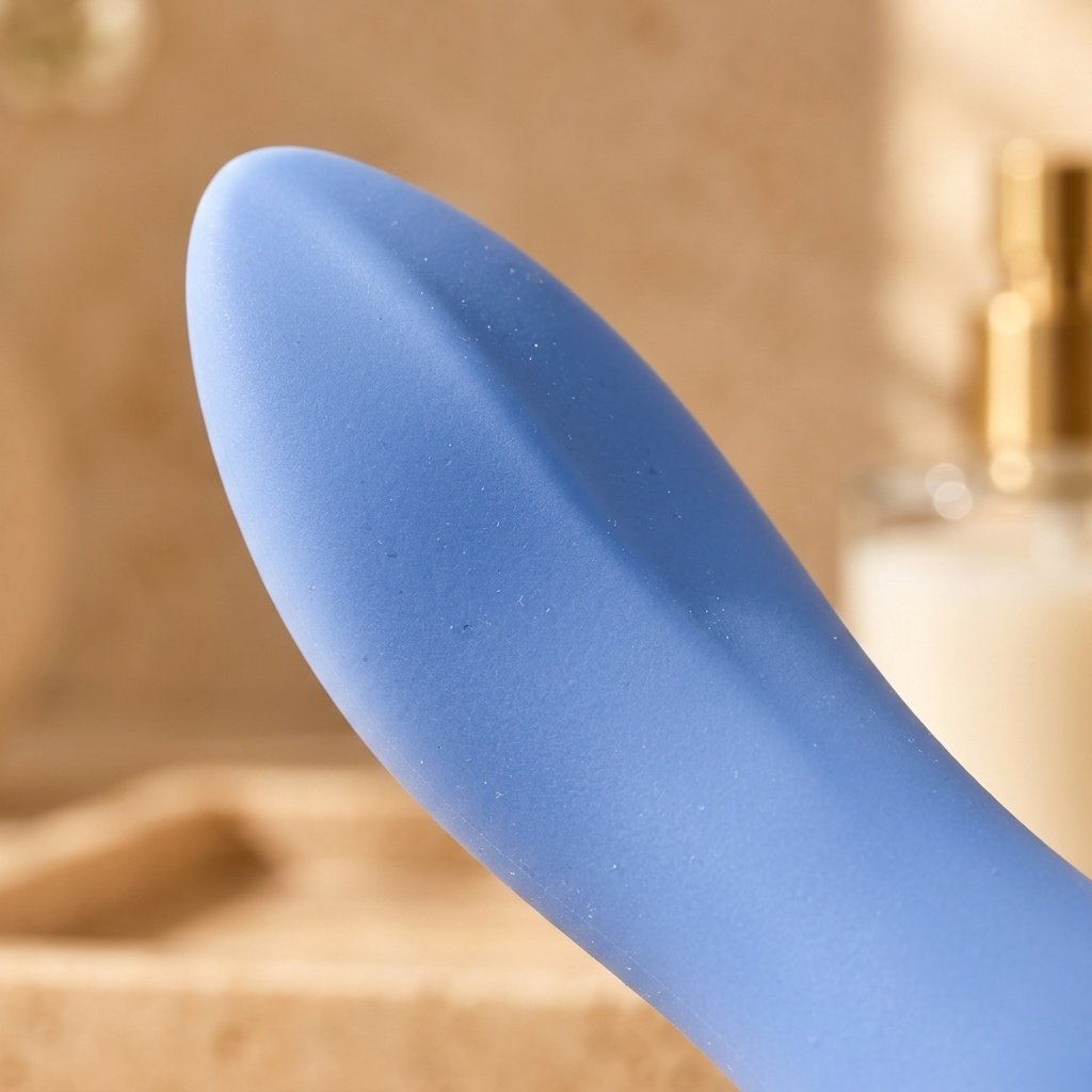 Extreme macro close-up photograph of the Dame Dip's soft tapered scoop tip showing the prominent raised central ridge along the top edge
