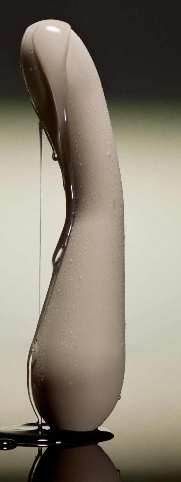 Authentic photograph of the Maude Spot vibrator glistening with water droplets, illustrating water resistance for shower use