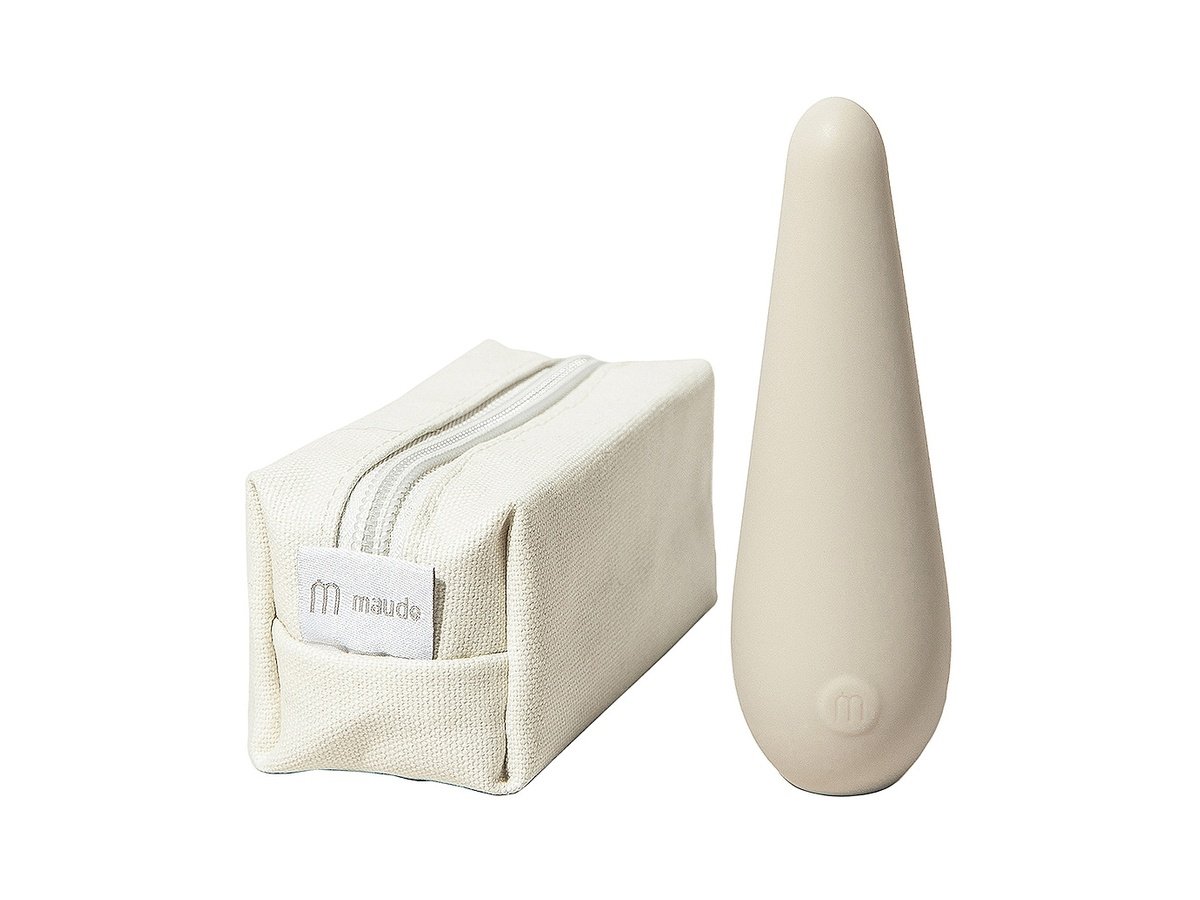 Authentic photograph of the Maude Vibe vibrator standing upright beside its unbleached canvas travel pouch with woven brand label
